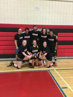 Sunday League Action - Team photo with court and bleachers backdrop